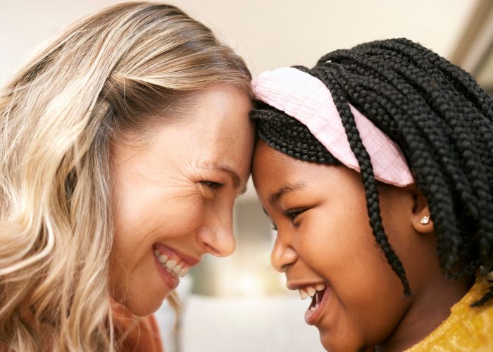 Bonding, love and girl with a foster mother for safety, care and happiness in a family home. Foster